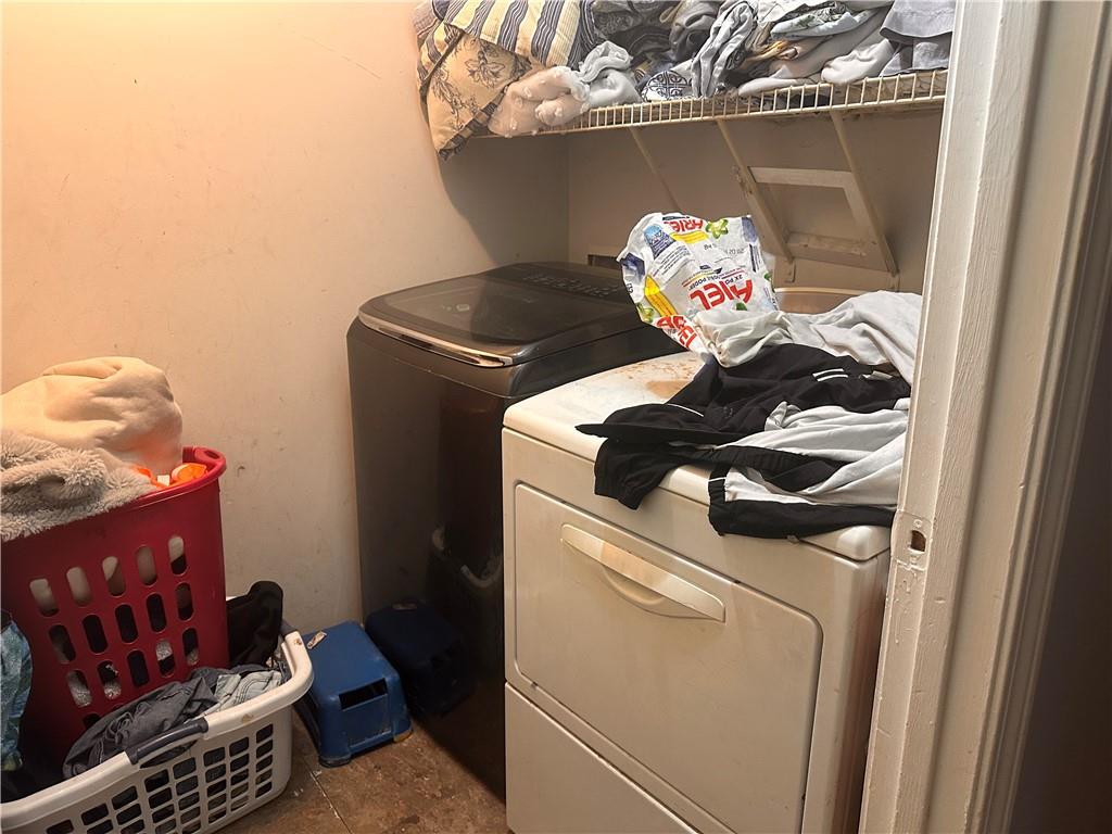1637 Roman Point Drive Norcross, GA 30093 - Photo 15 of 21 a close view of a utility room with dryer and washer