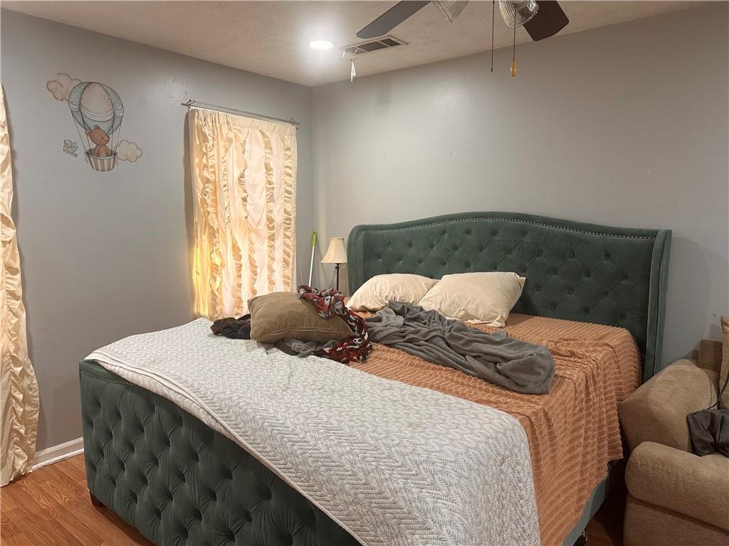 1637 Roman Point Drive Norcross, GA 30093 - Photo 18 of 21 a bedroom with a bed and window