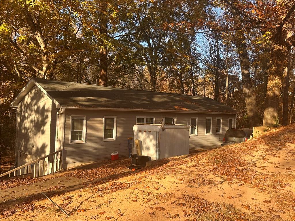 1637 Roman Point Drive Norcross, GA 30093 - Photo 2 of 21 a front view of a house with a yard