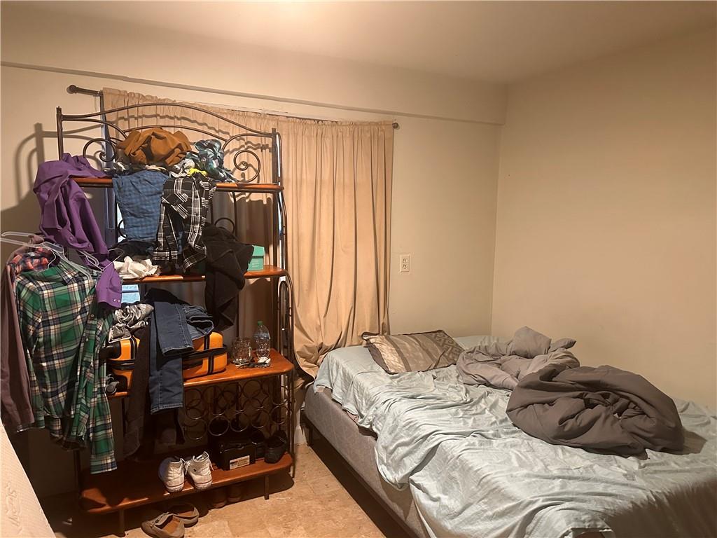 1637 Roman Point Drive Norcross, GA 30093 - Photo 21 of 21 a bedroom with a bed and a window