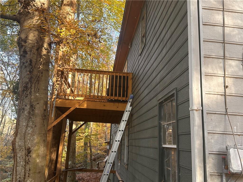 1637 Roman Point Drive Norcross, GA 30093 - Photo 5 of 21 a view of balcony with wooden floor and fence