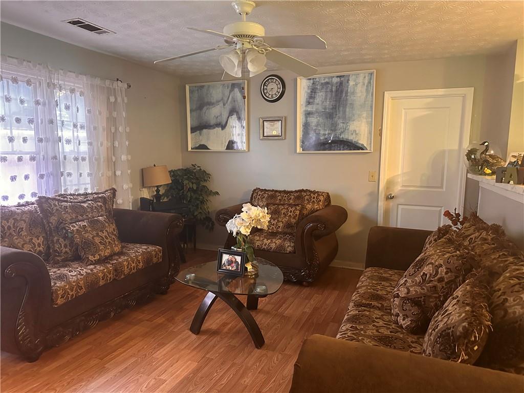 1637 Roman Point Drive Norcross, GA 30093 - Photo 6 of 21 a living room with furniture and a window