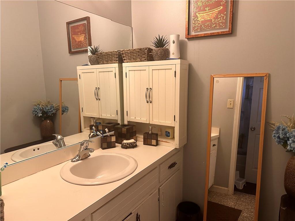 1637 Roman Point Drive Norcross, GA 30093 - Photo 9 of 21 a bathroom with a sink and a mirror