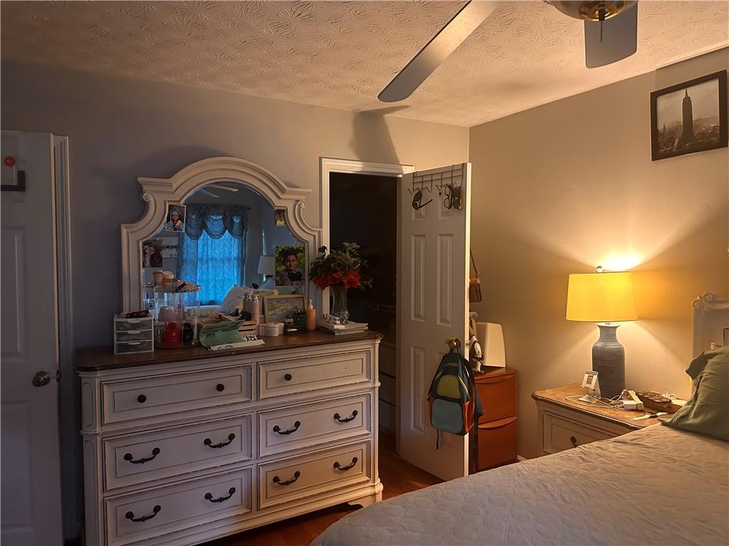 1637 Roman Point Drive Norcross, GA 30093 - Photo 10 of 21 a bedroom with a bed and a dresser