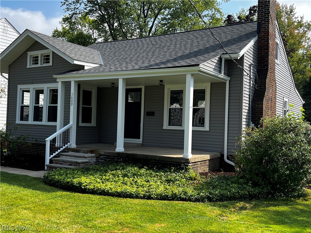 1609 Lyndhurst Road Lyndhurst, OH 44124 - Photo 3 of 34 View of front facade with a front yard and a porch