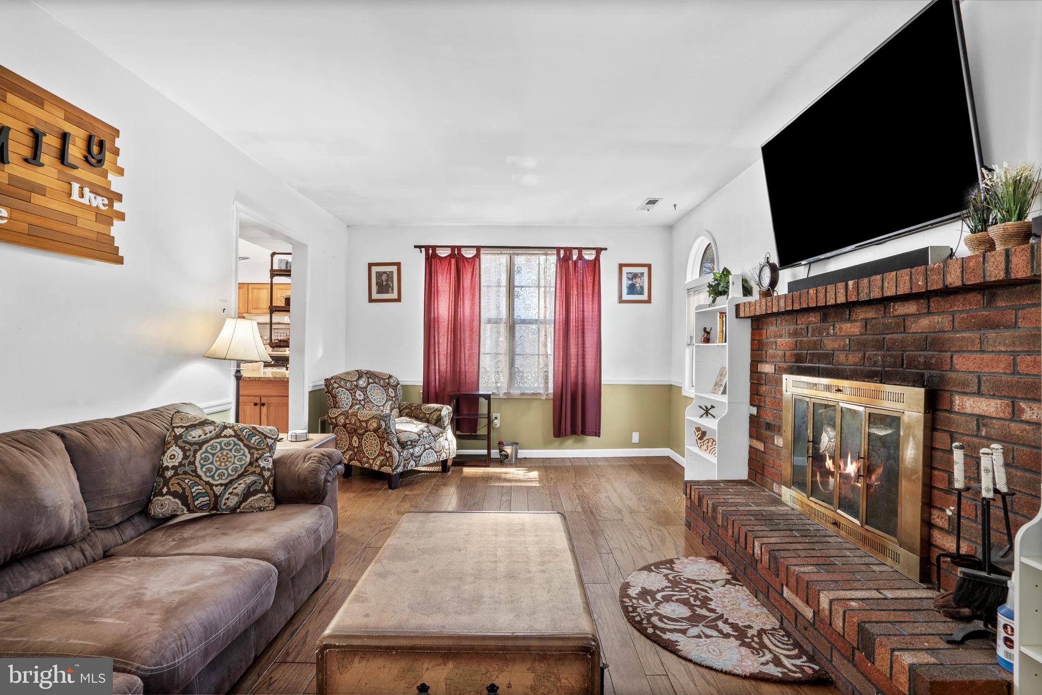 18 Essex Lane Langhorne, PA 19047 - Photo 18 of 50 a living room with furniture and a flat screen tv