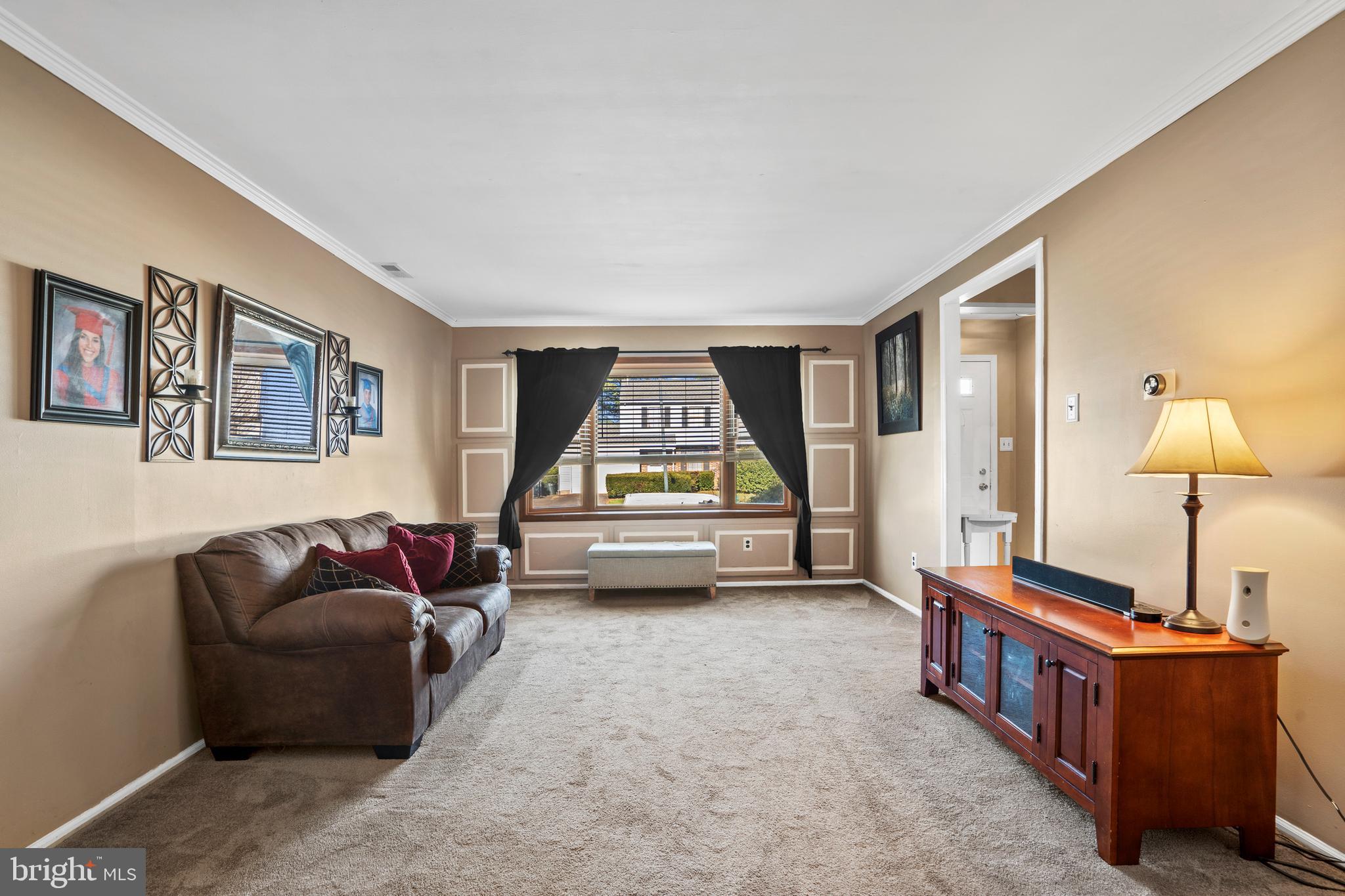 18 Essex Lane Langhorne, PA 19047 - Photo 21 of 50 a living room with furniture and a lamp