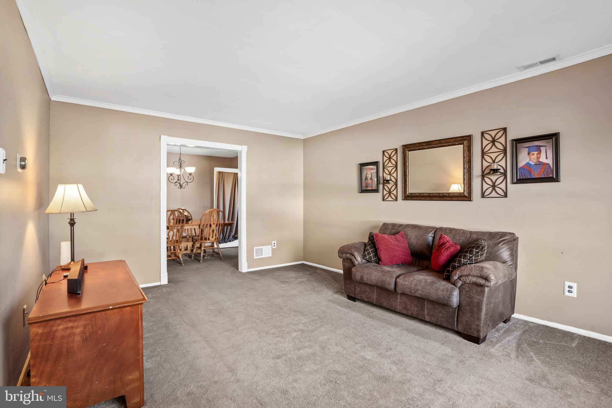18 Essex Lane Langhorne, PA 19047 - Photo 22 of 50 a living room with furniture and a lamp