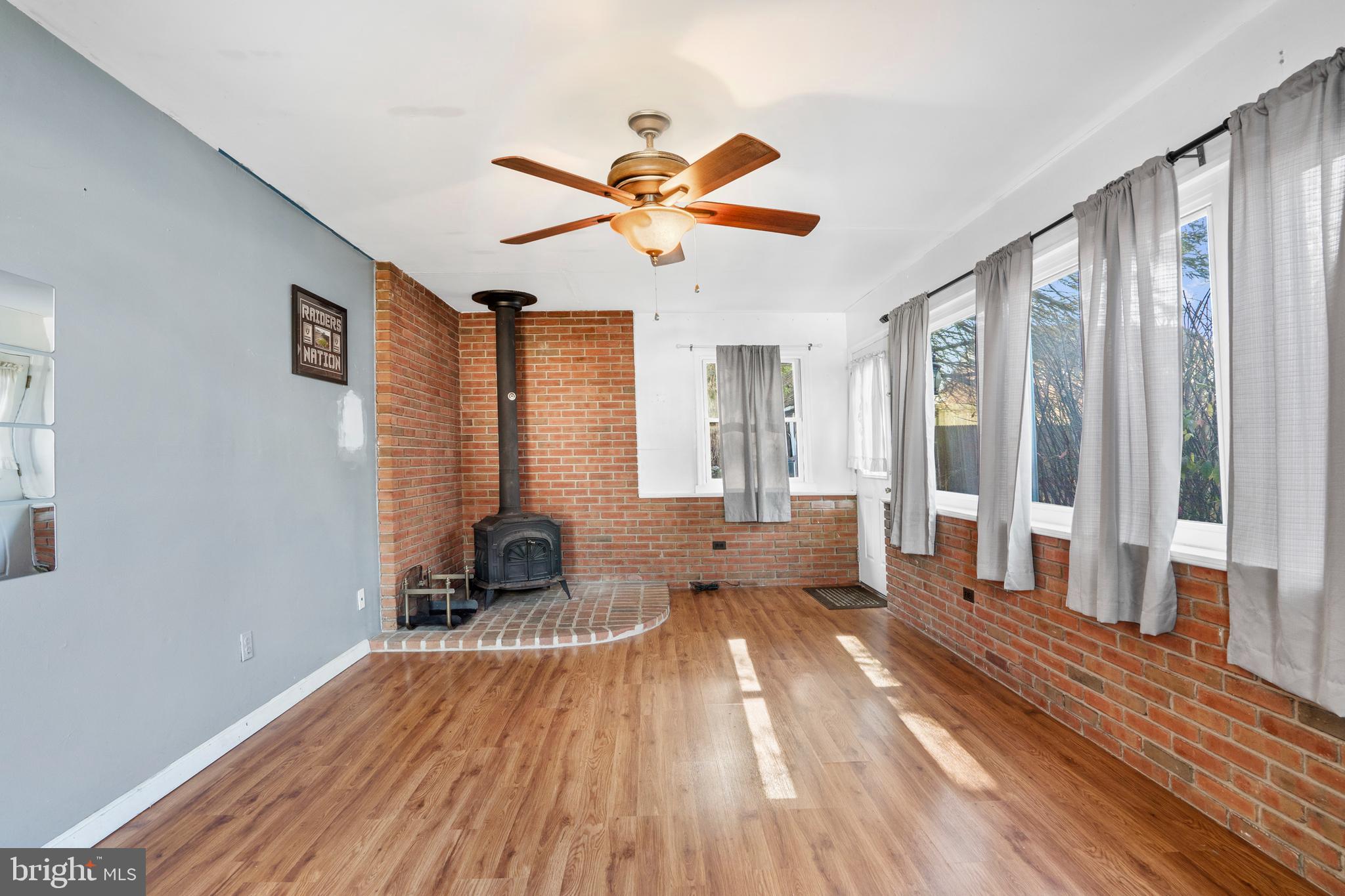 18 Essex Lane Langhorne, PA 19047 - Photo 25 of 50 a living room with wooden floor furniture and a large window