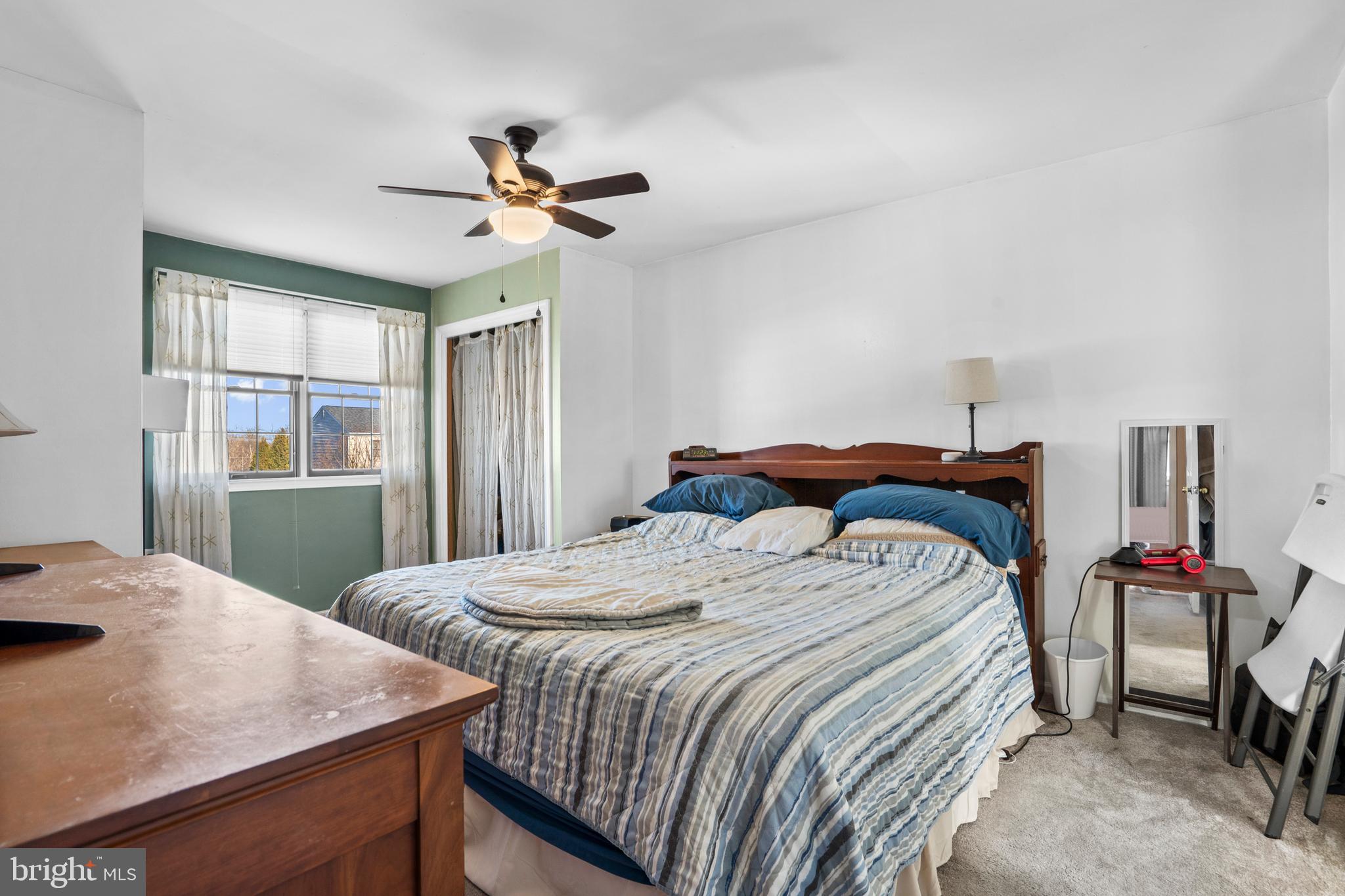 18 Essex Lane Langhorne, PA 19047 - Photo 27 of 50 a bedroom with a bed and a table