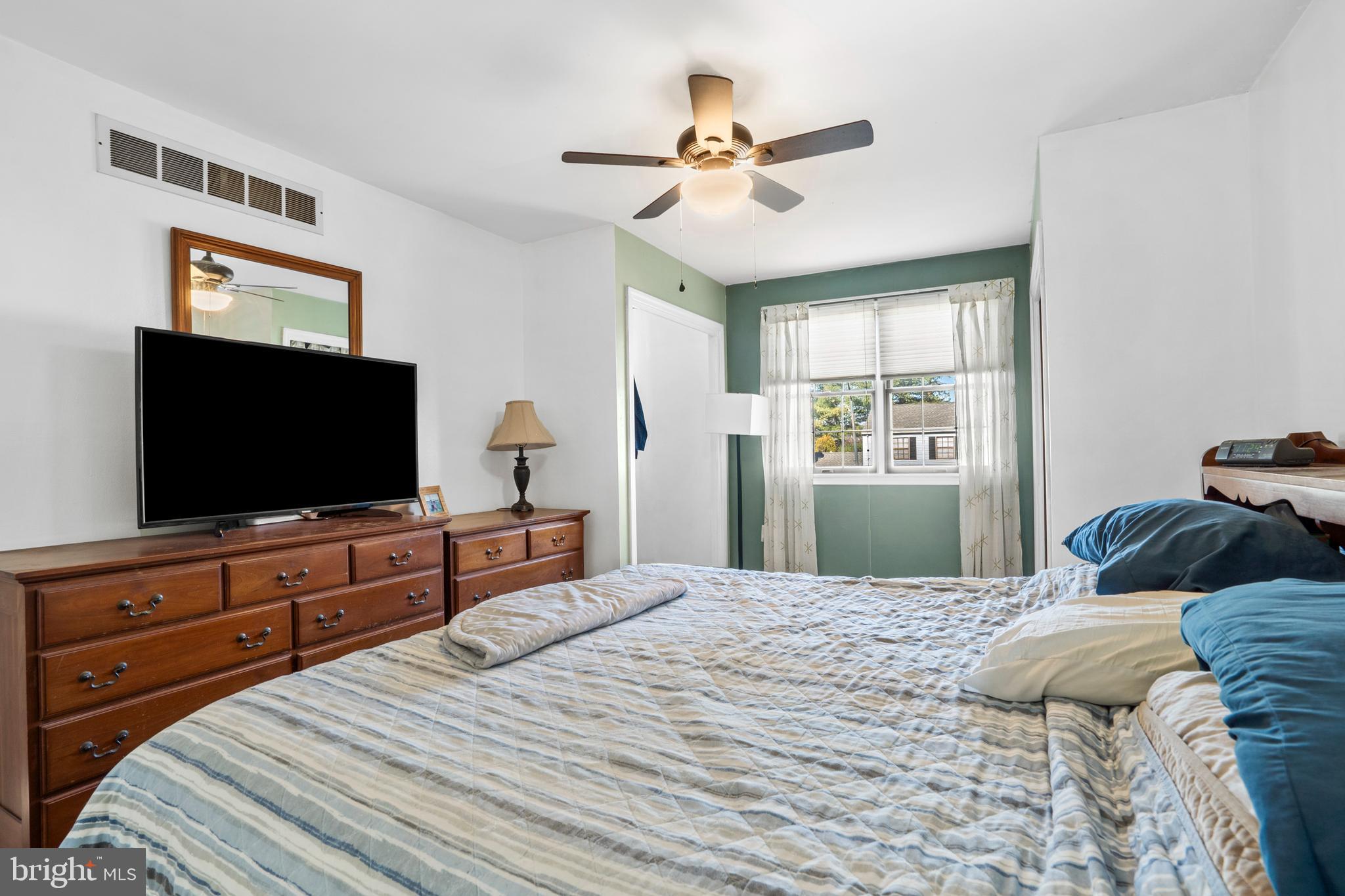 18 Essex Lane Langhorne, PA 19047 - Photo 28 of 50 a bedroom with a bed and a flat screen tv