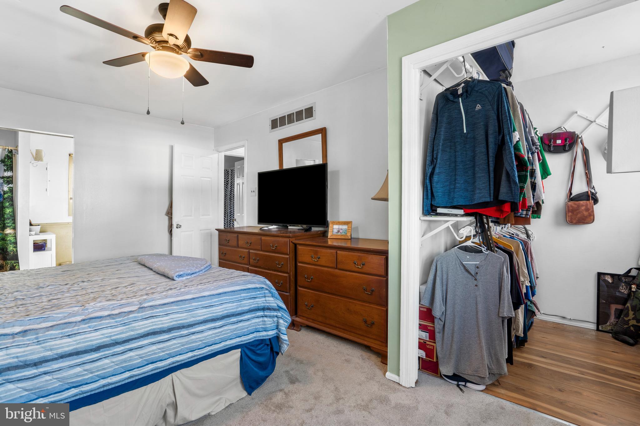 18 Essex Lane Langhorne, PA 19047 - Photo 29 of 50 a bedroom with a bed and a flat tv screen on dresser