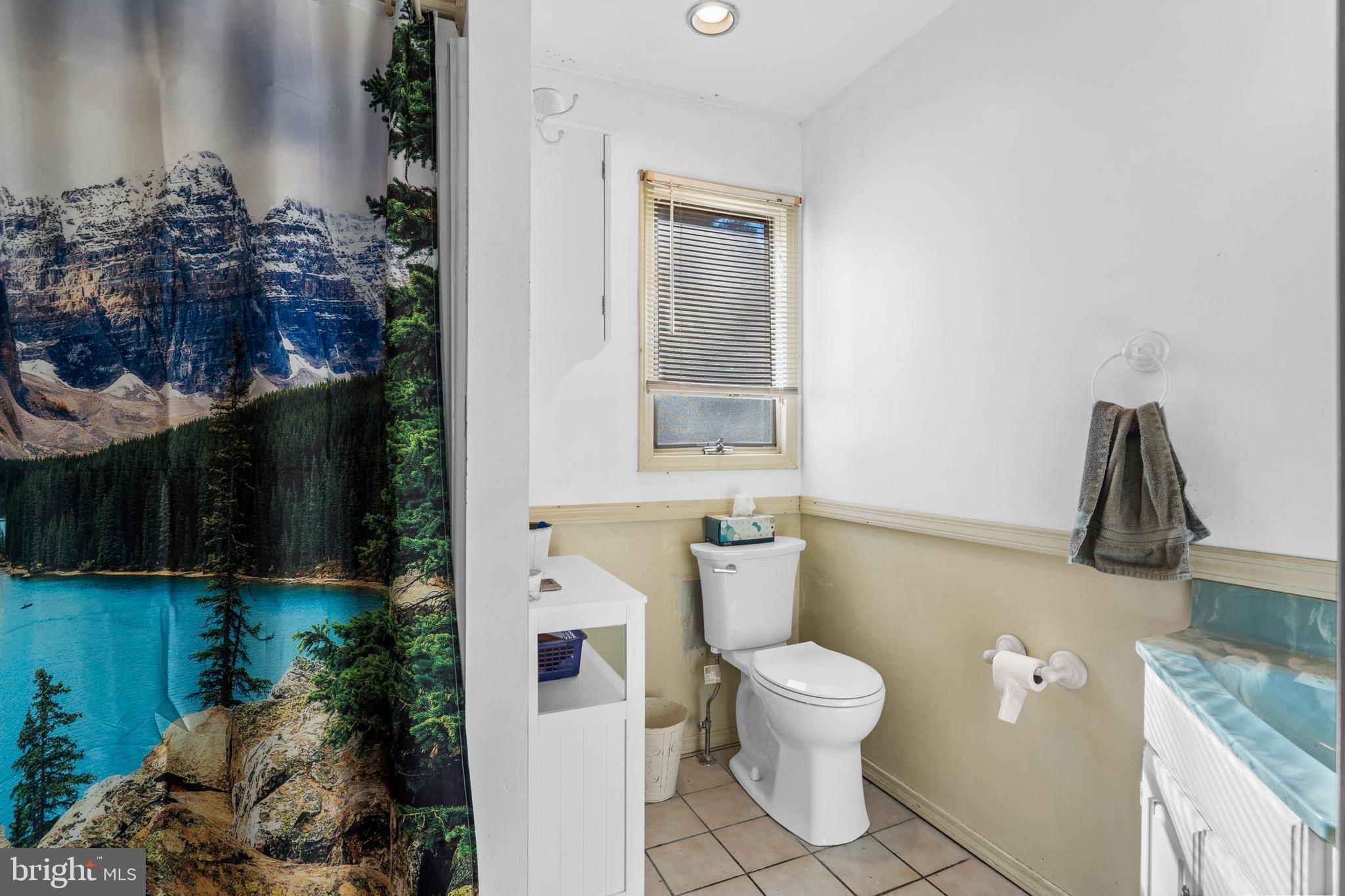 18 Essex Lane Langhorne, PA 19047 - Photo 30 of 50 a bathroom with a toilet a sink and a window