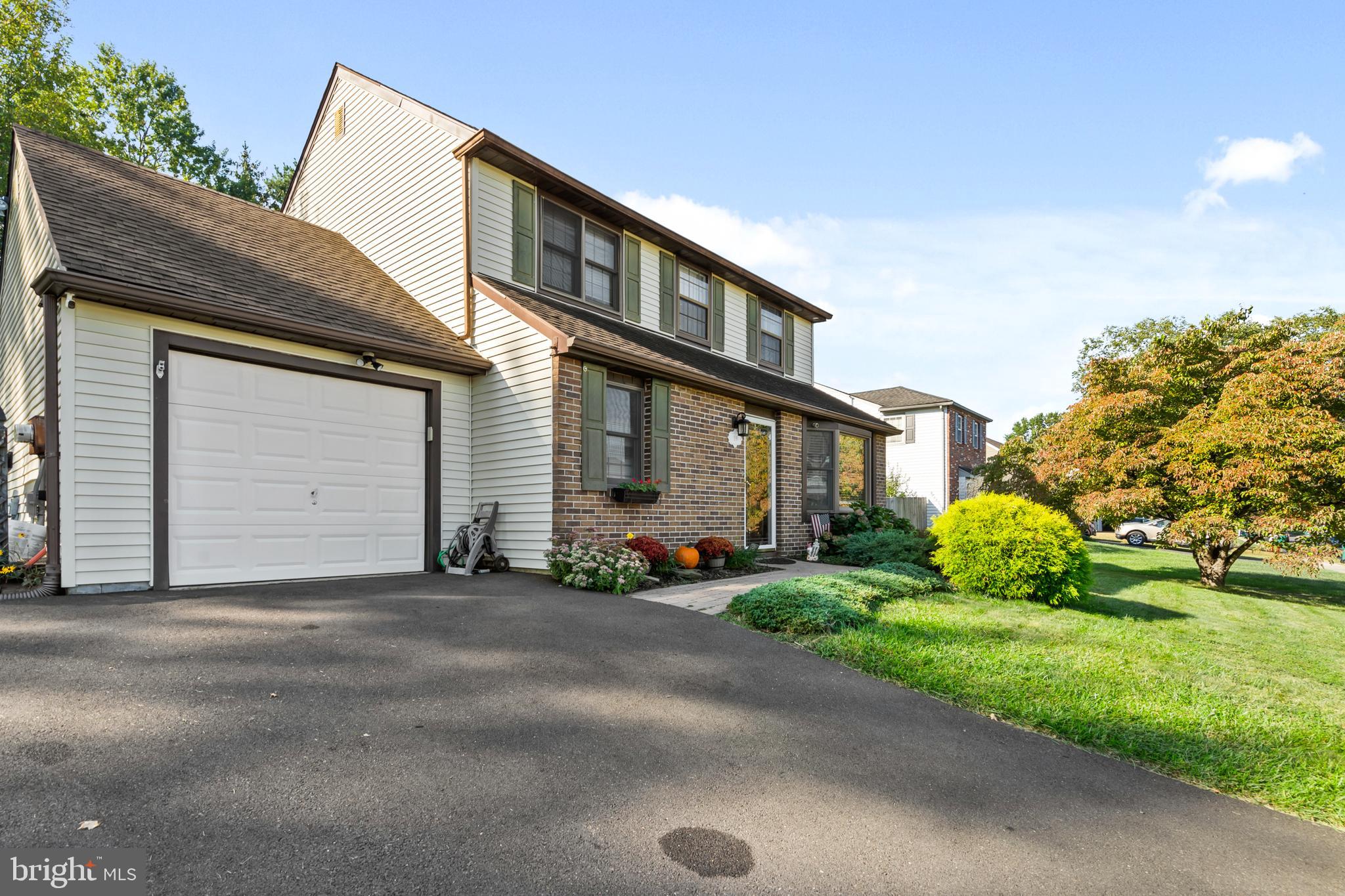 18 Essex Lane Langhorne, PA 19047 - Photo 3 of 50 a front view of a house with a garden and plants