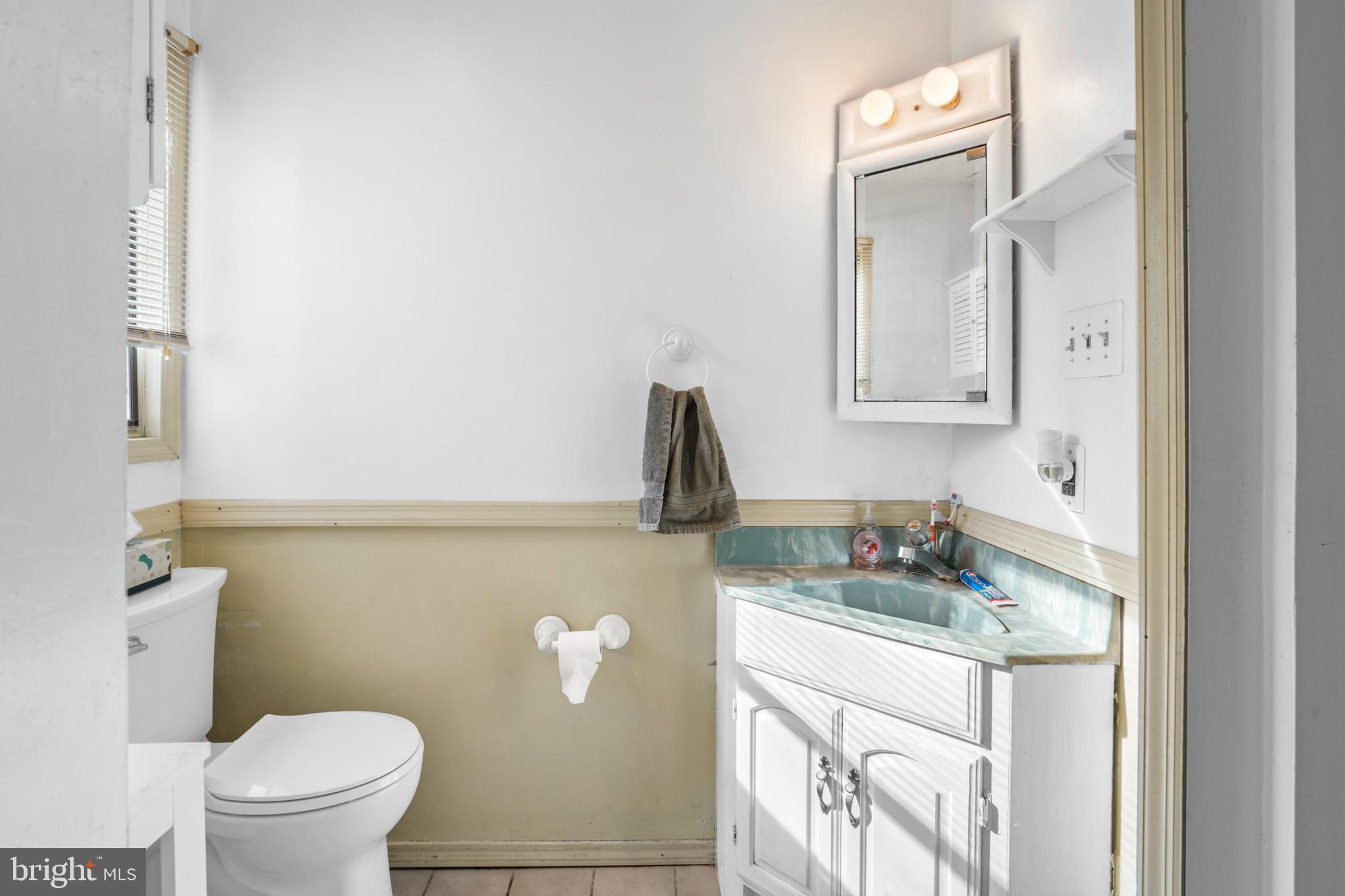 18 Essex Lane Langhorne, PA 19047 - Photo 32 of 50 a bathroom with a granite countertop sink and a toilet