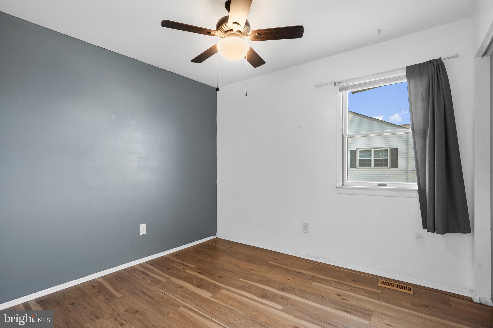 18 Essex Lane Langhorne, PA 19047 - Photo 36 of 50 a view of a livingroom with wooden floor and ceiling fan