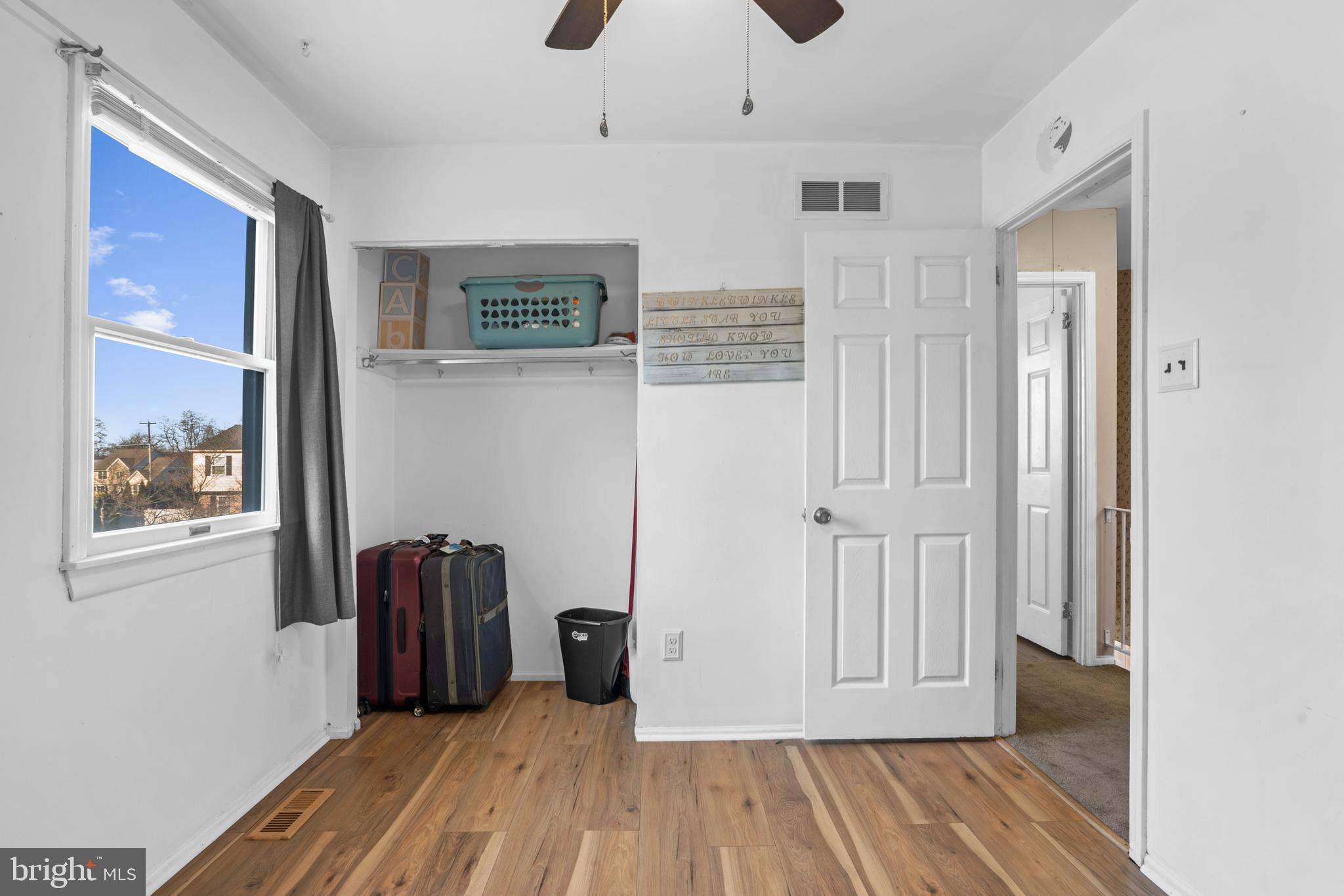 18 Essex Lane Langhorne, PA 19047 - Photo 37 of 50 a view of a livingroom with wooden floor and a window