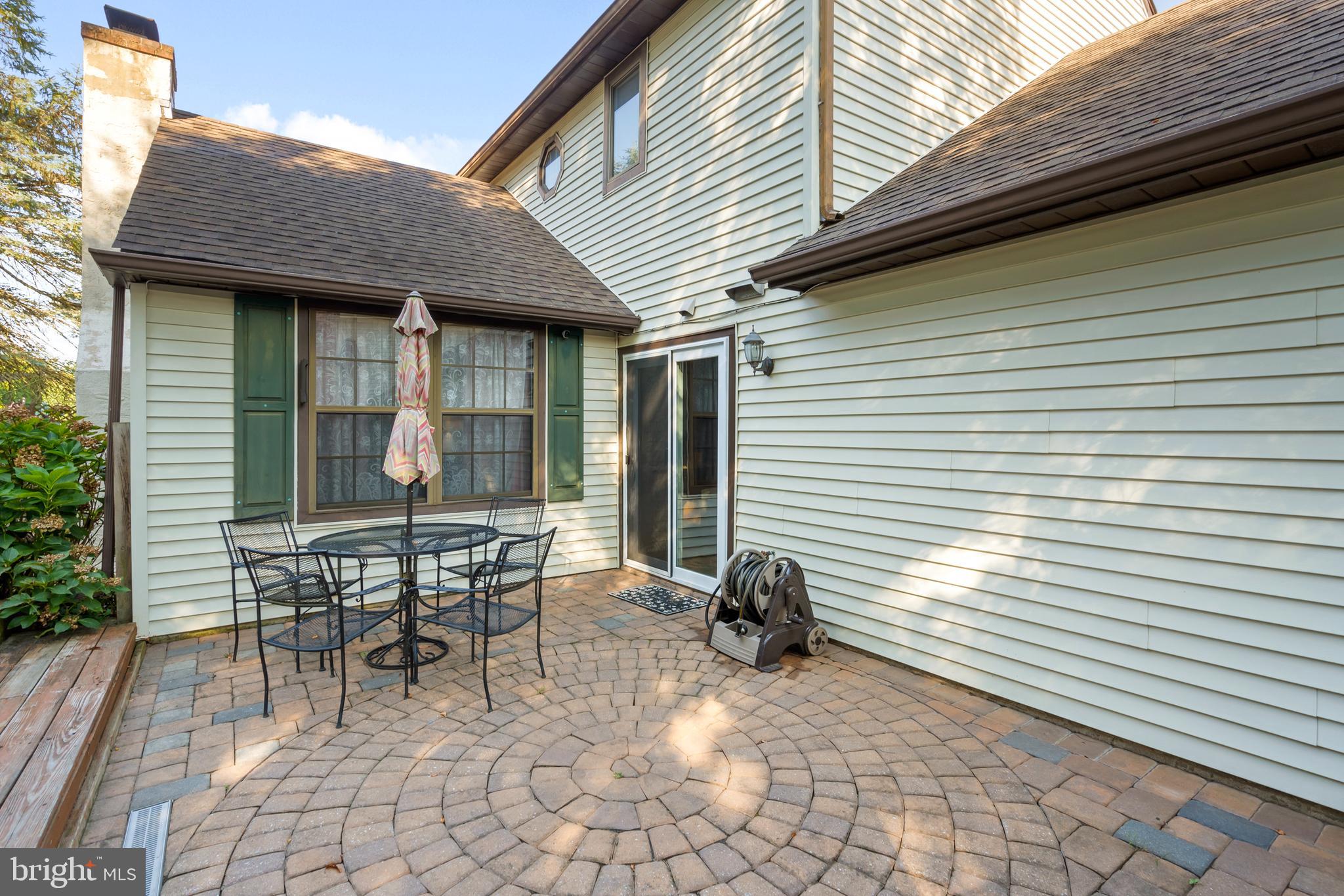 18 Essex Lane Langhorne, PA 19047 - Photo 40 of 50 a backyard of a house with table and chairs