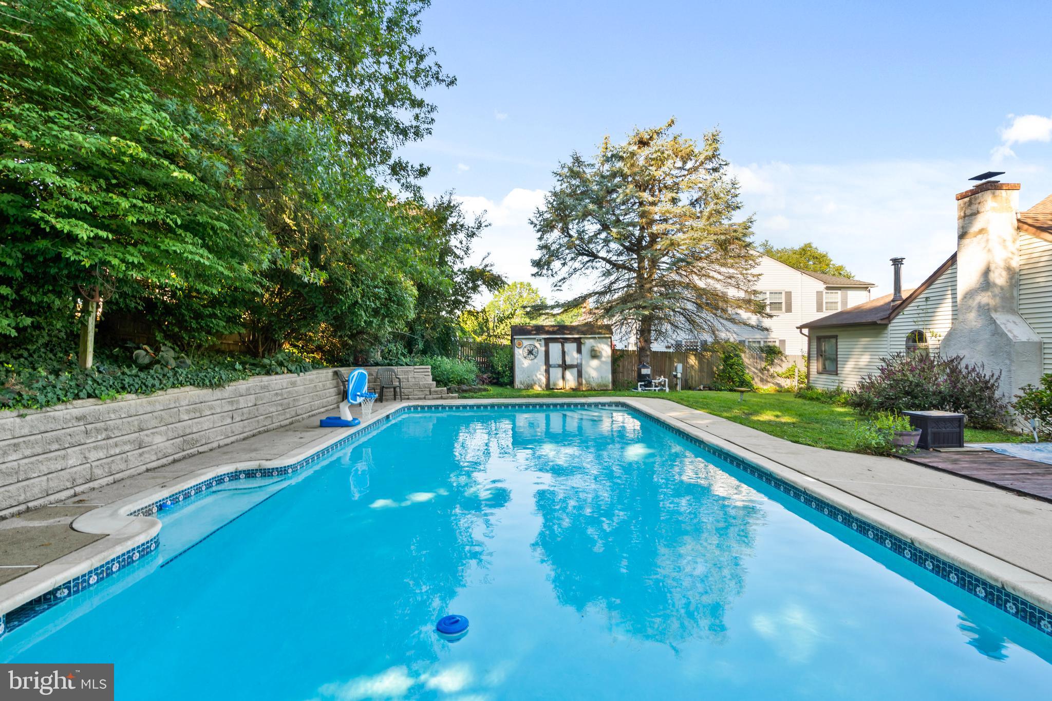 18 Essex Lane Langhorne, PA 19047 - Photo 44 of 50 a view of a swimming pool with a yard