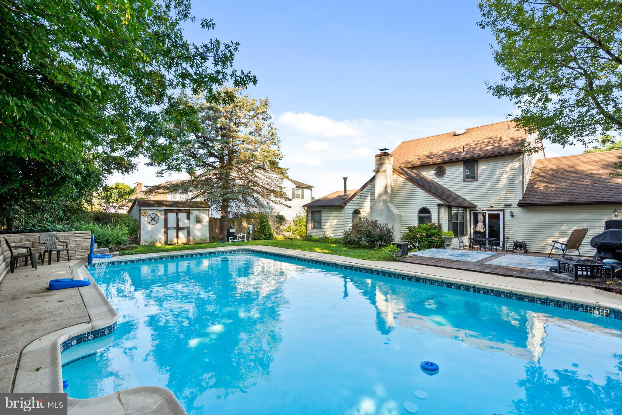 18 Essex Lane Langhorne, PA 19047 - Photo 45 of 50 a view of a house with pool lawn chairs and a barbeque