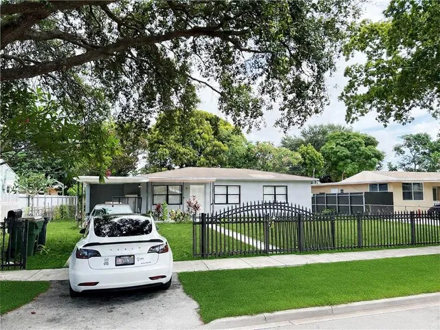a view of a house with a roof deck