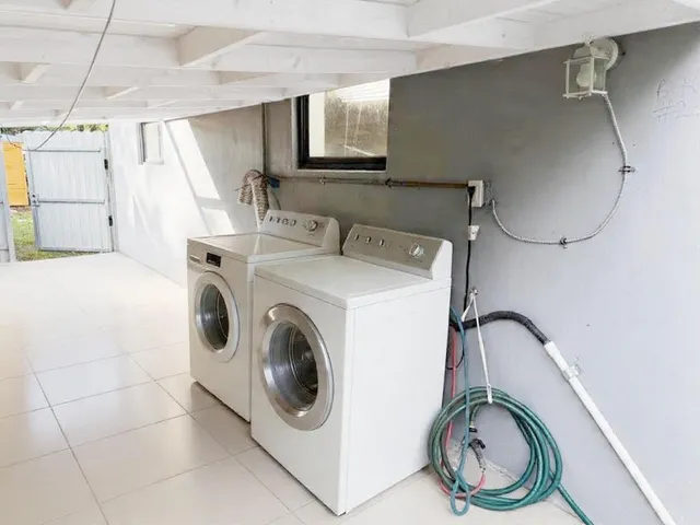 a utility room with dryer and washer