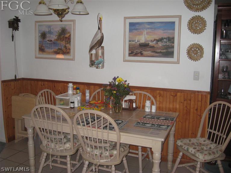 17485 Braddock Road Fort Myers, FL 33967 - Photo 3 of 11 a view of a dining room with furniture