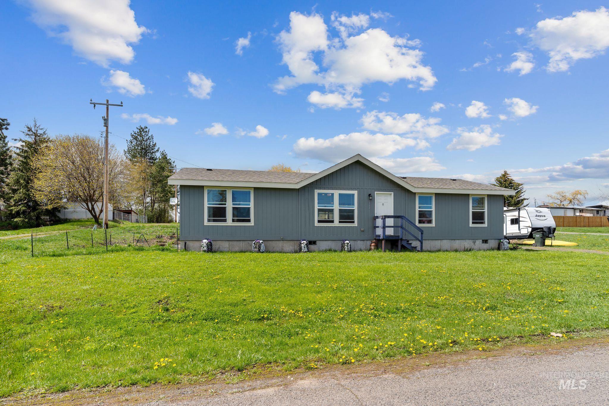 302 3rd Avenue Craigmont, ID 83523 - Photo 1 of 31 Single-story residence featuring a gray exterior with white trim windows and a dark gray shingle roof