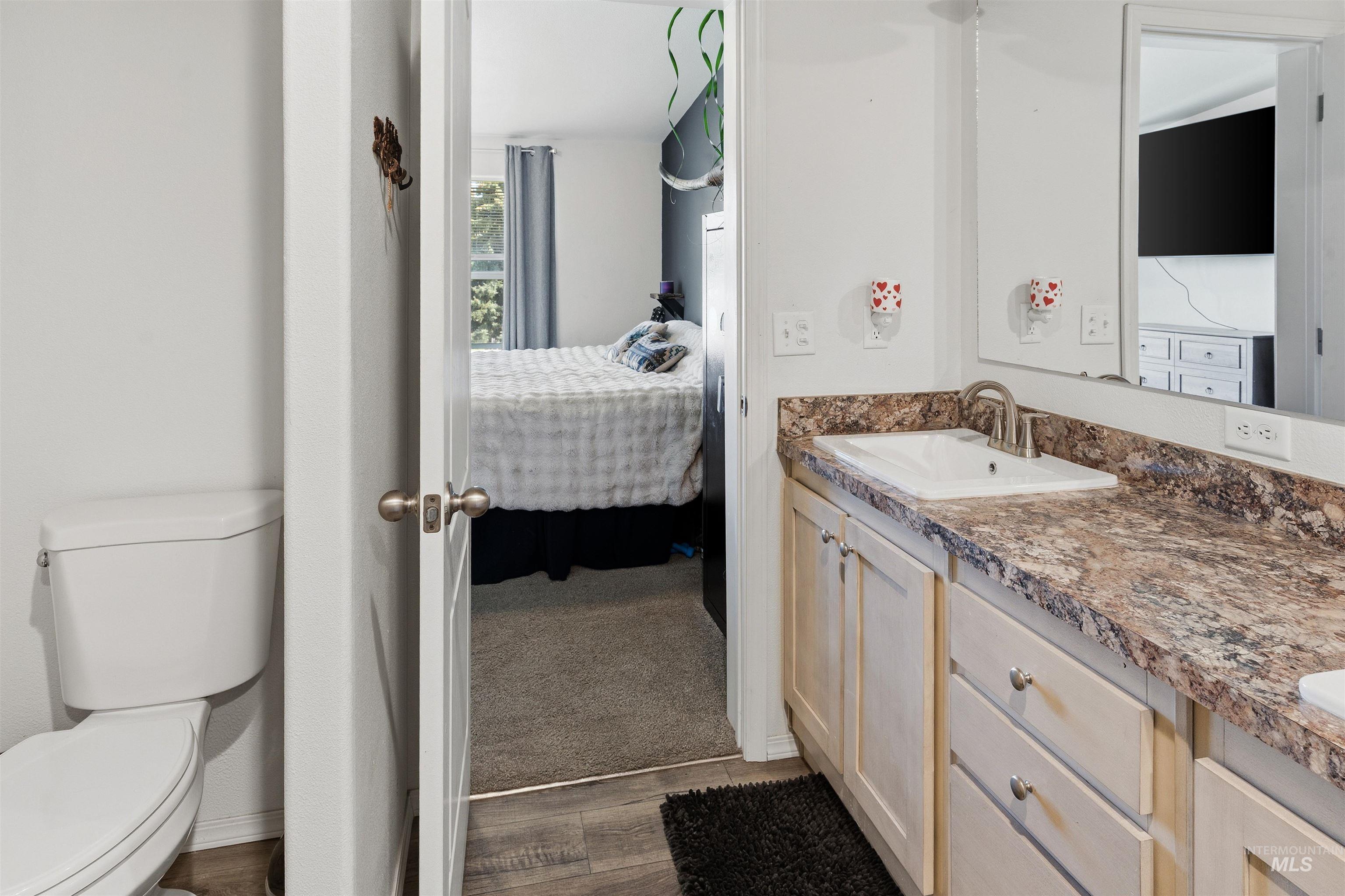 302 3rd Avenue Craigmont, ID 83523 - Photo 11 of 31 Bathroom vanity featuring an integrated sink, brushed nickel faucet, and a spacious countertop