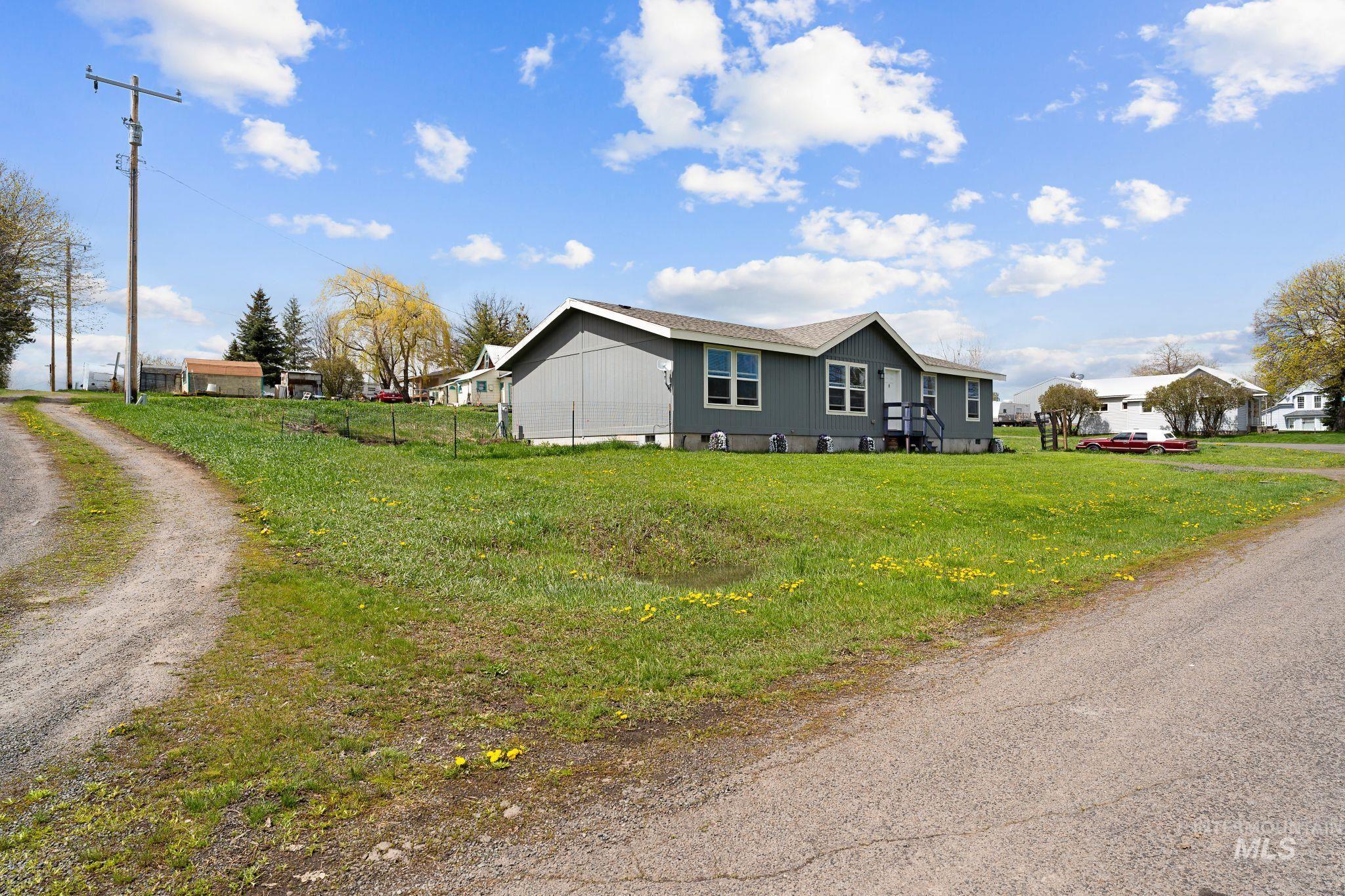302 3rd Avenue Craigmont, ID 83523 - Photo 2 of 31 Exterior featuring a gray siding finish, white trim, and a covered entry