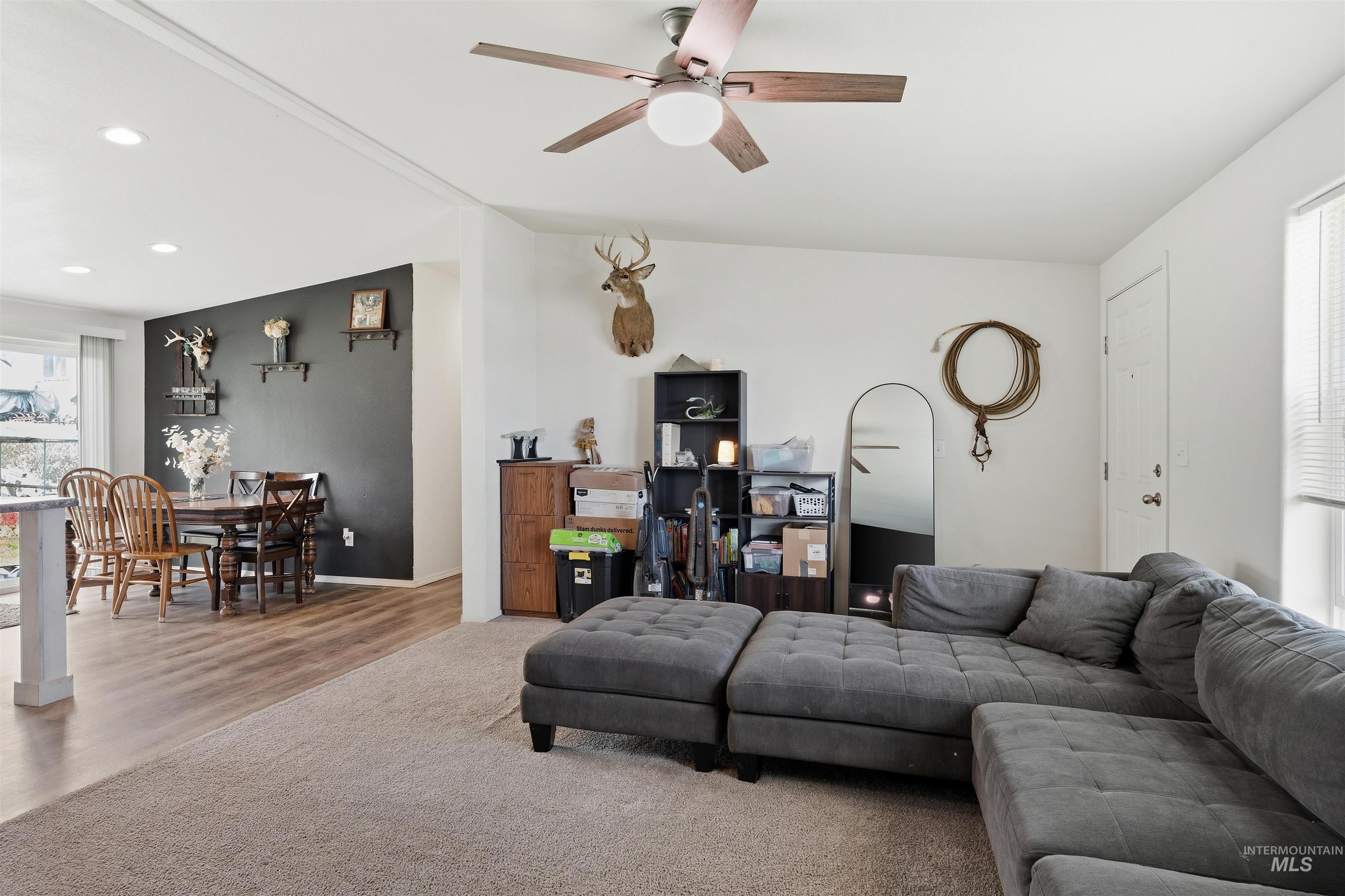 302 3rd Avenue Craigmont, ID 83523 - Photo 27 of 31 Open-concept living area with a ceiling fan, recessed lighting, and a neutral carpeted floor