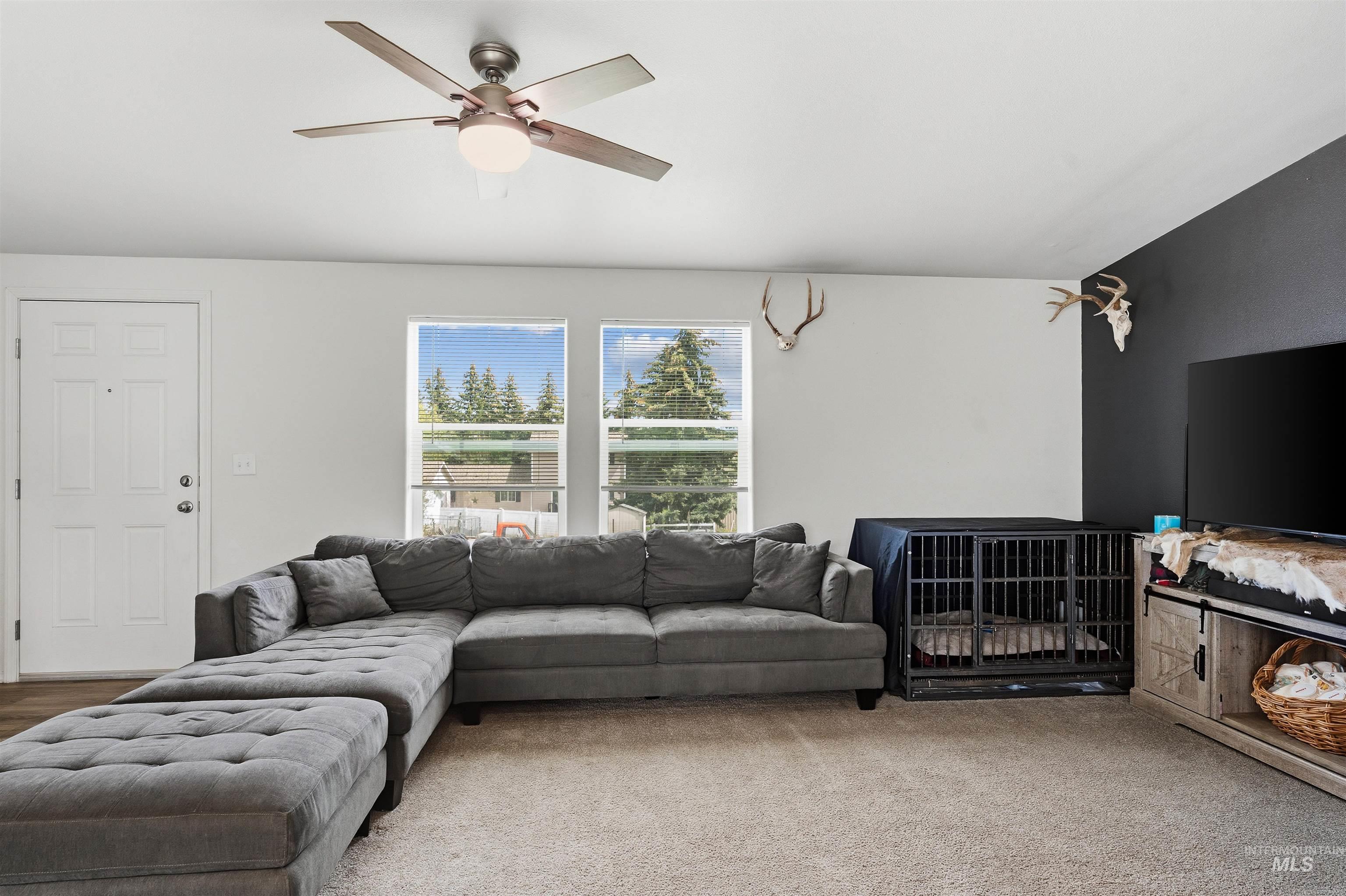 302 3rd Avenue Craigmont, ID 83523 - Photo 8 of 31 Living area with light neutral walls and an accent wall
