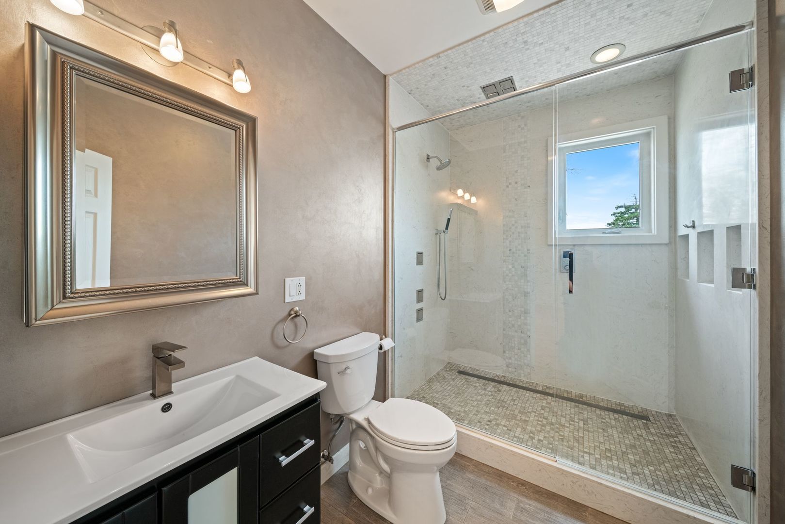 701 Oakton Street Park Ridge, IL 60068 - Photo 35 of 59 a bathroom with a sink a toilet and shower