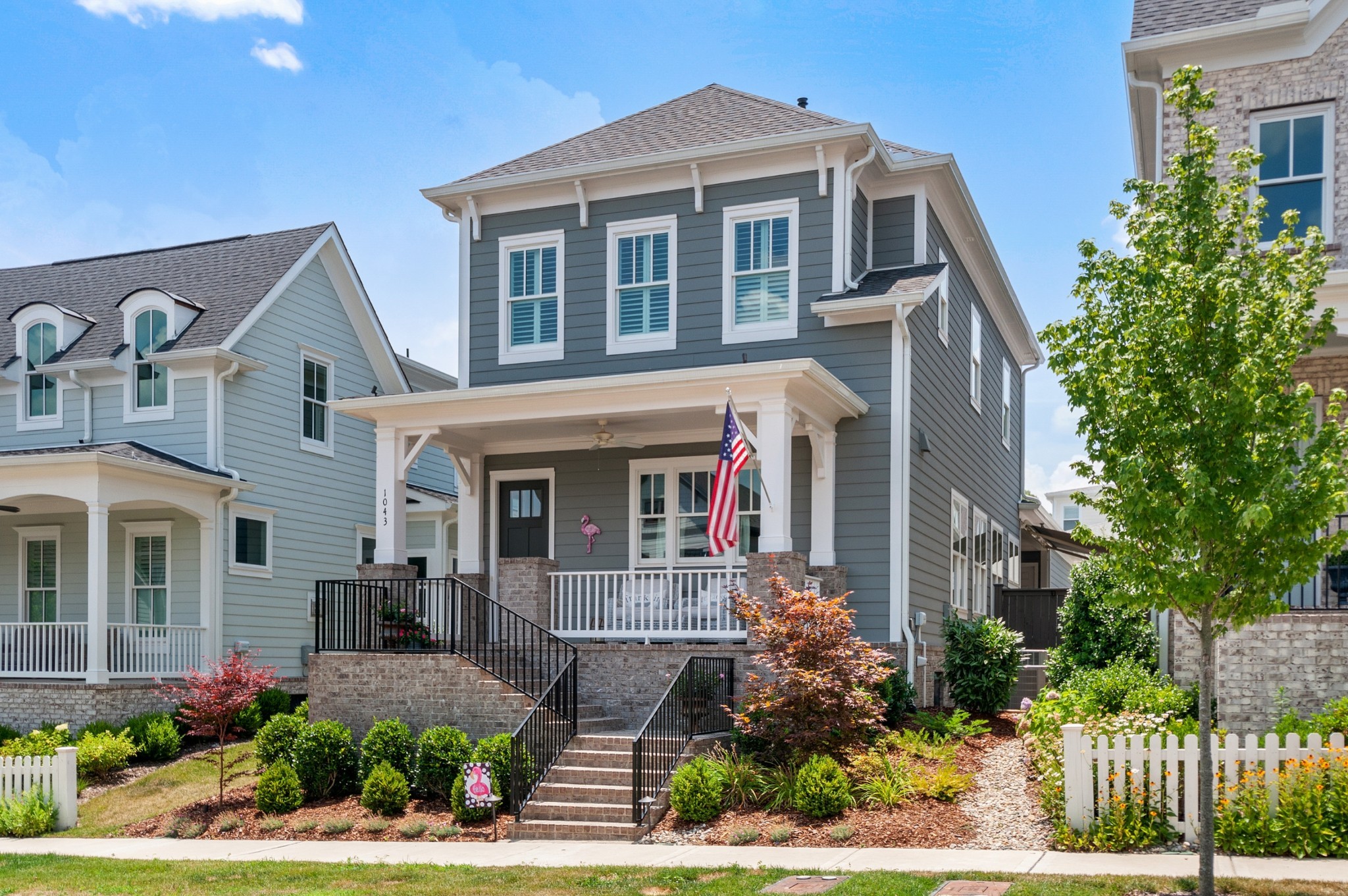 1043 Calico Street Franklin, TN 37064 - Photo 1 of 35 a front view of a house with garden