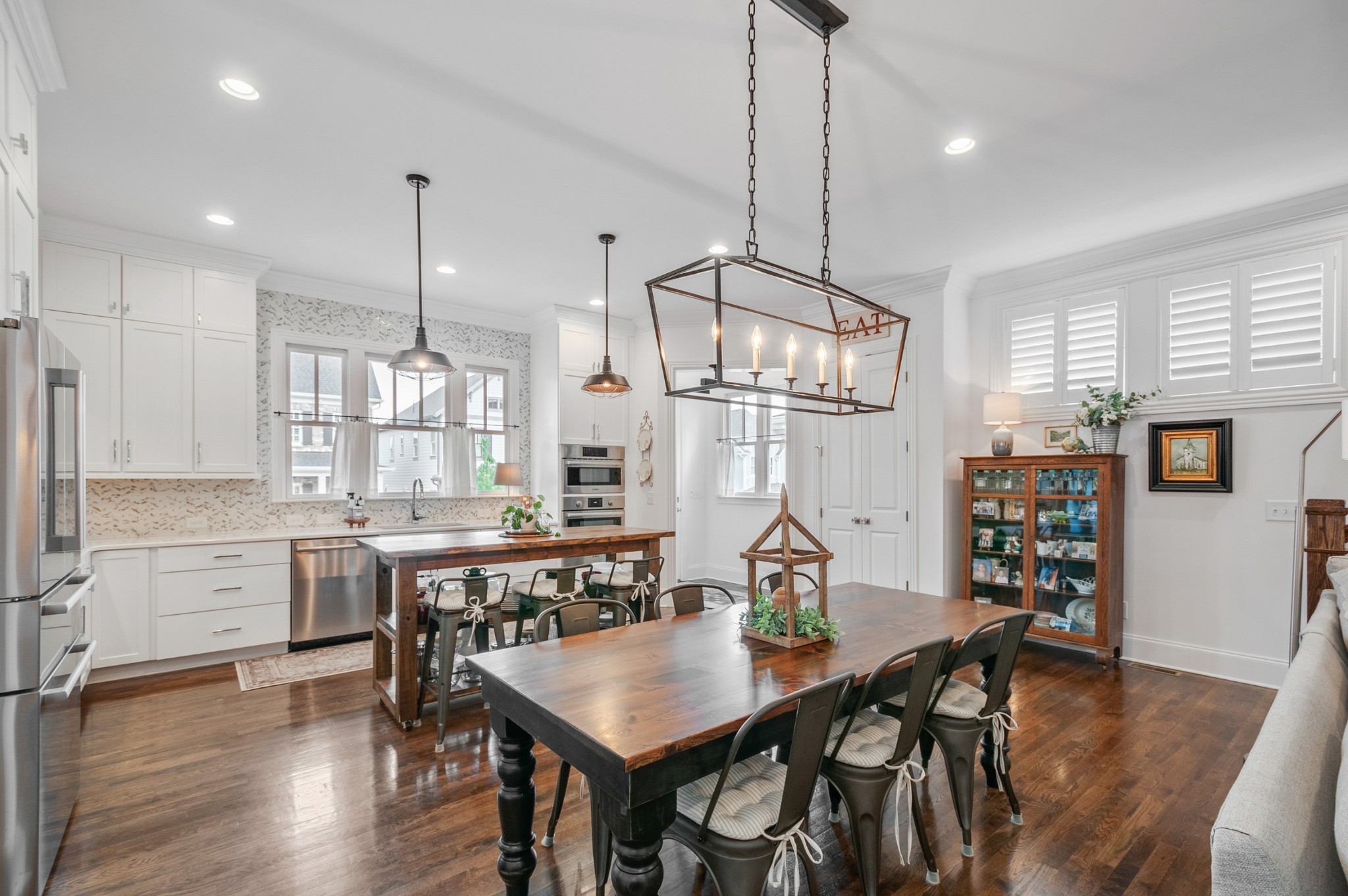1043 Calico Street Franklin, TN 37064 - Photo 11 of 35 a view of a dining room and livingroom with furniture wooden floor a chandelier
