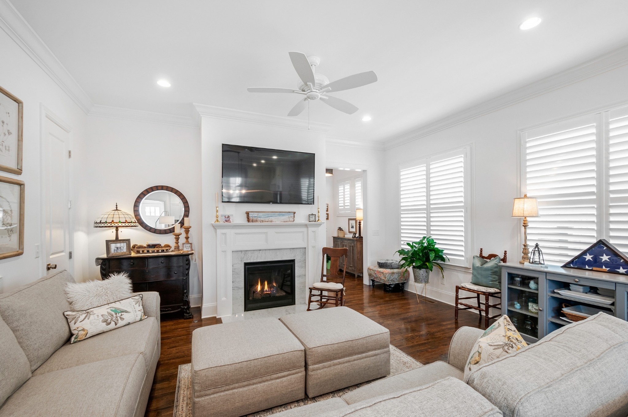 1043 Calico Street Franklin, TN 37064 - Photo 12 of 35 a living room with furniture a fireplace and a flat screen tv