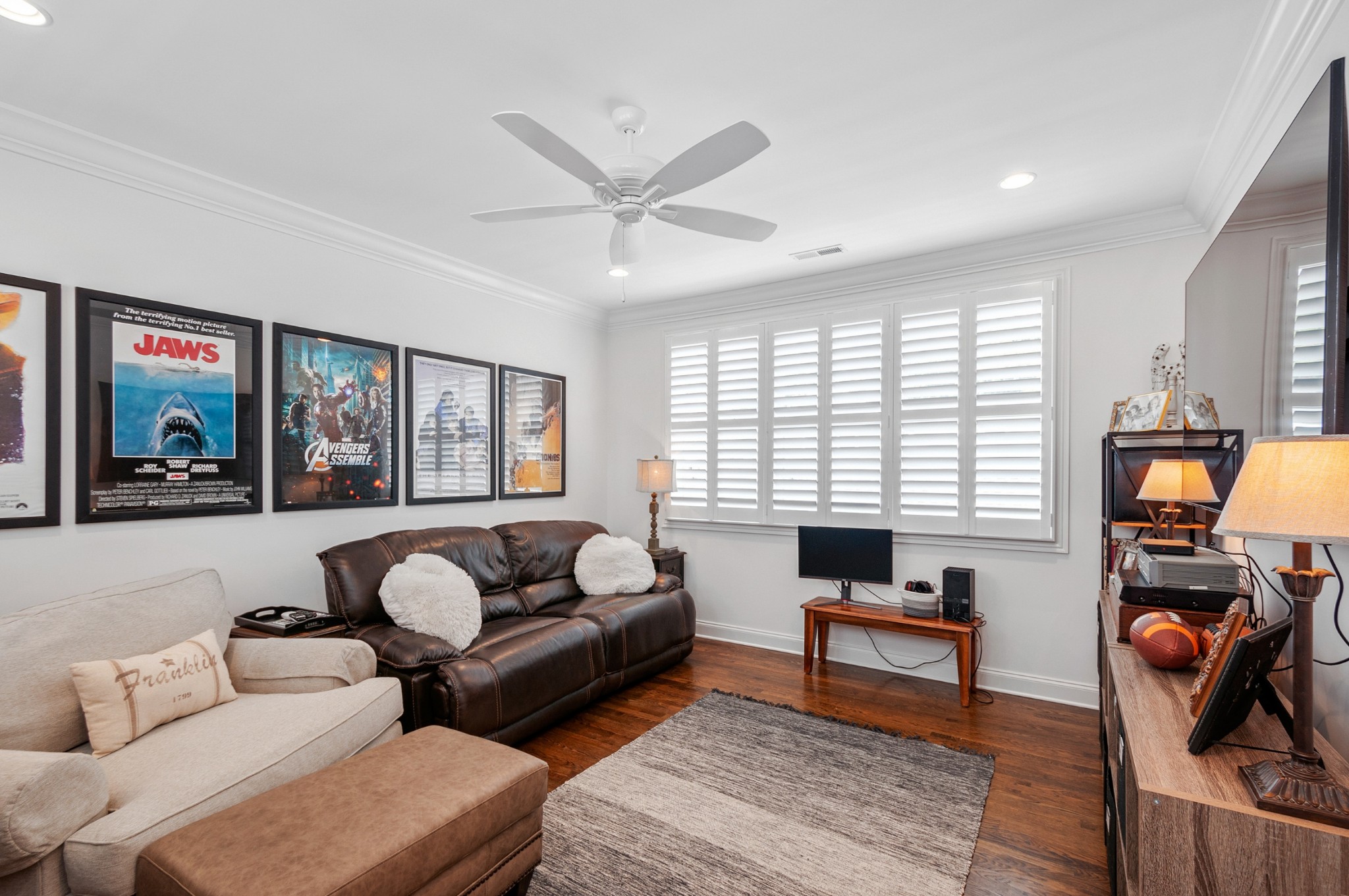 1043 Calico Street Franklin, TN 37064 - Photo 24 of 35 a living room with furniture and a flat screen tv with wooden floor