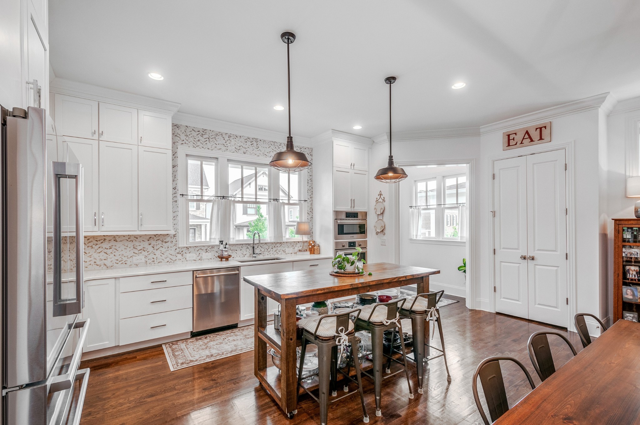 1043 Calico Street Franklin, TN 37064 - Photo 6 of 35 a kitchen with a table chairs stove and cabinets