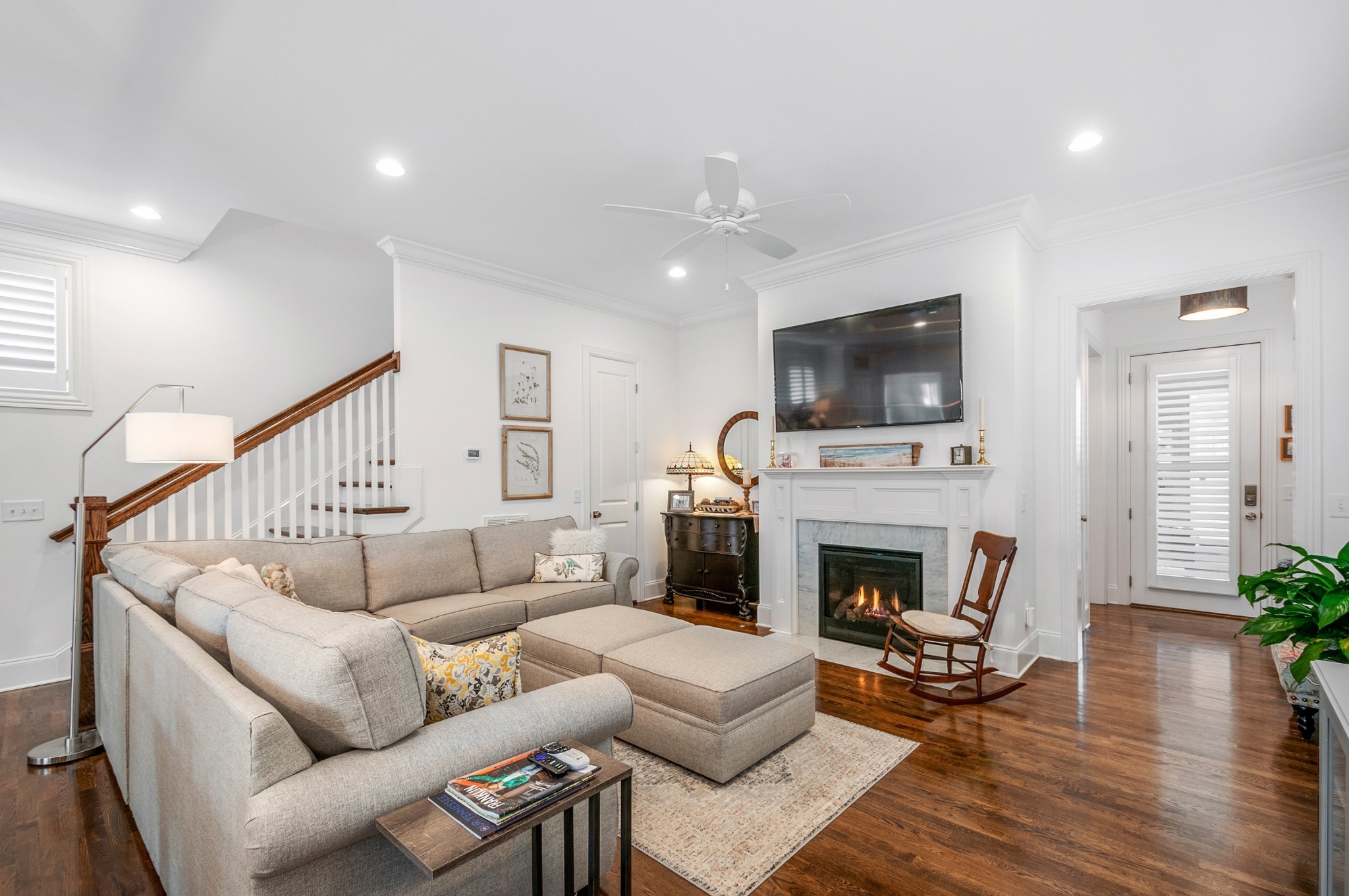 1043 Calico Street Franklin, TN 37064 - Photo 9 of 35 a living room with furniture a fireplace and a flat screen tv