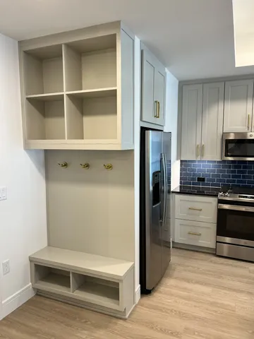 a bathroom with a tub a sink and mirror