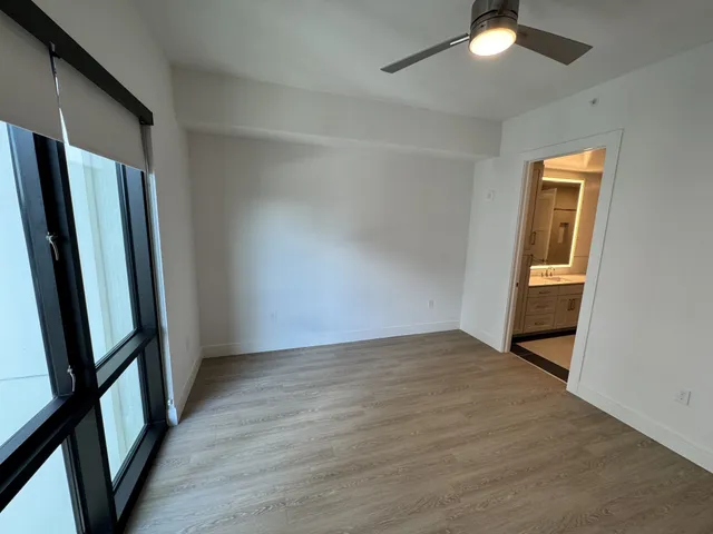a kitchen with stainless steel appliances a refrigerator sink and stove