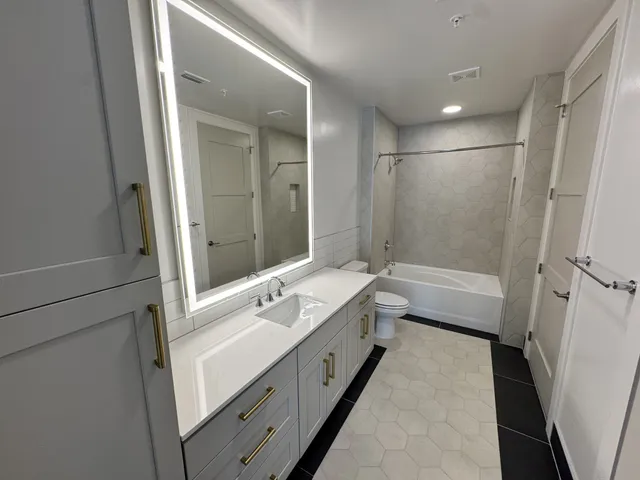 a bathroom with a bathtub and a toilet