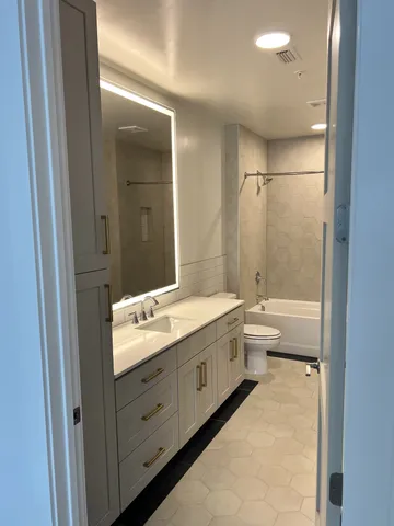 a view of a brick wall with wooden floor