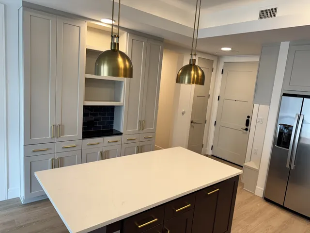 a gym room with furniture and a window
