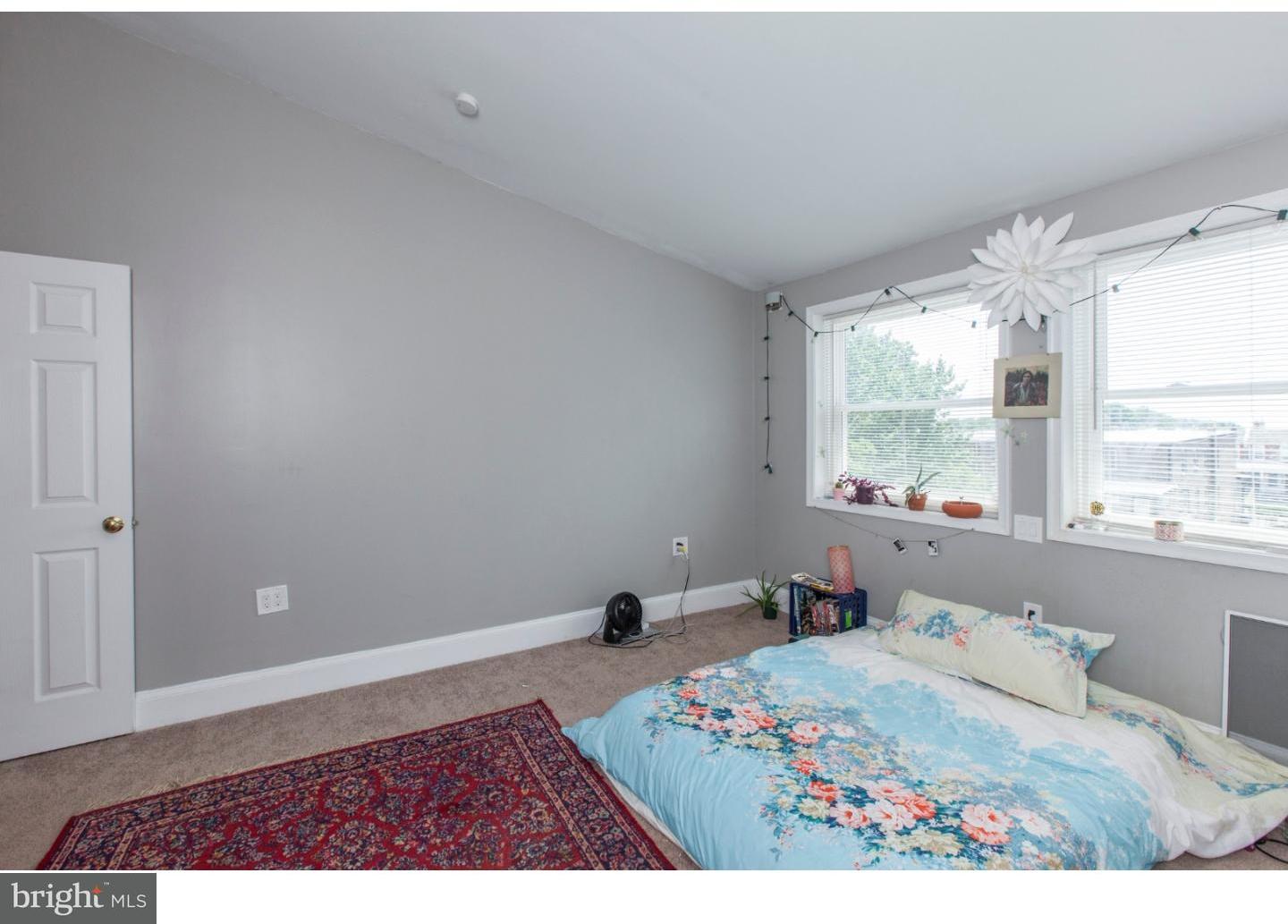 235 Roxborough Avenue Philadelphia, PA 19128 - Photo 15 of 22 a bed room with a bed and a window