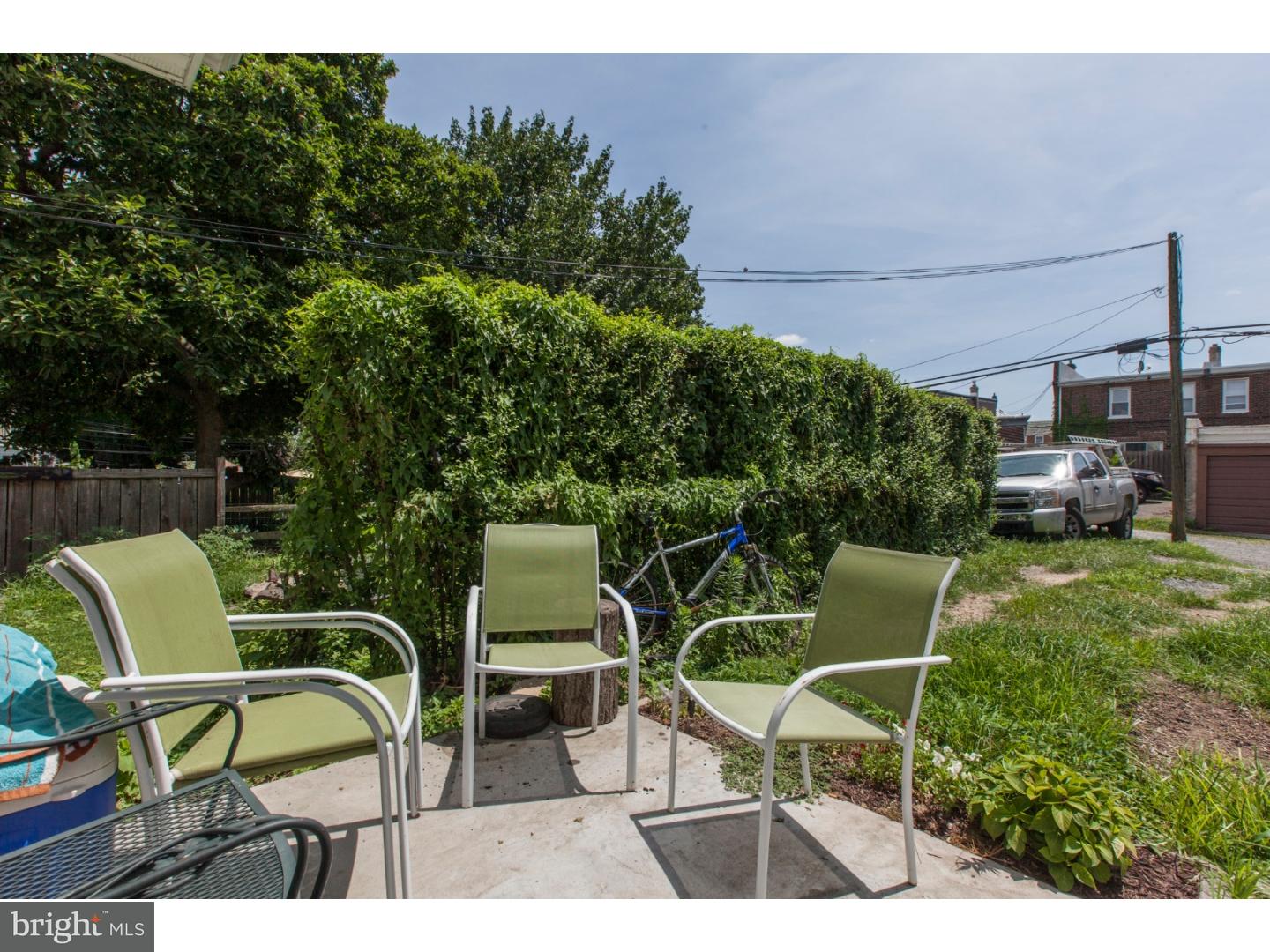 235 Roxborough Avenue Philadelphia, PA 19128 - Photo 18 of 22 a view of a chairs and tables in the back yard of the house