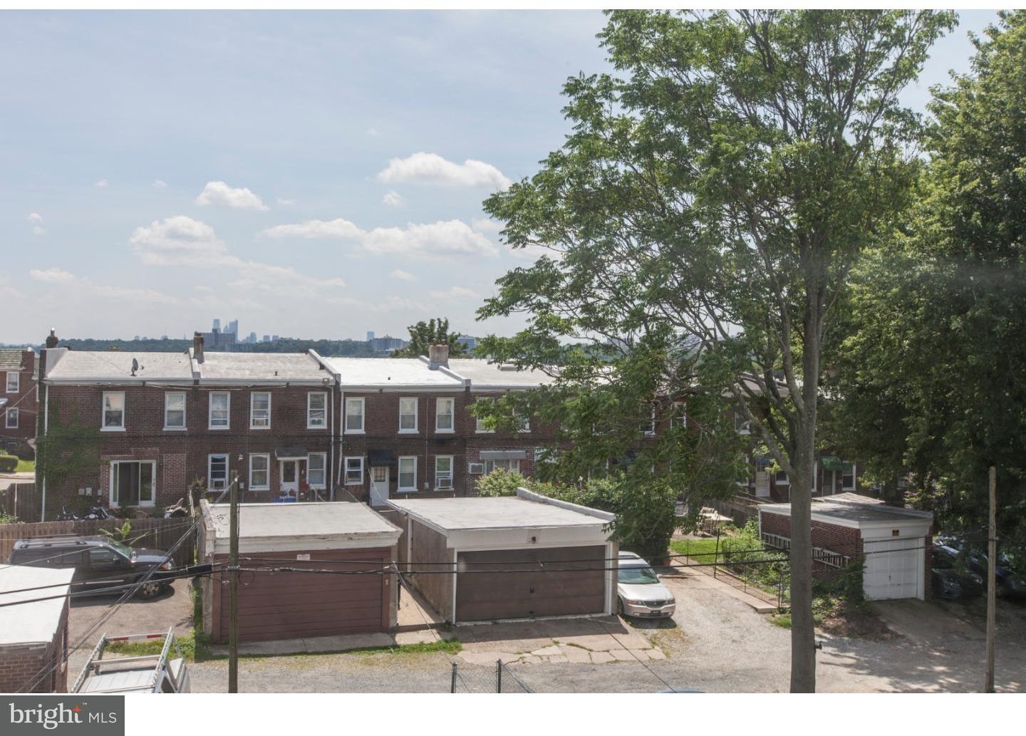 235 Roxborough Avenue Philadelphia, PA 19128 - Photo 22 of 22 a view of a house with backyard and sitting area