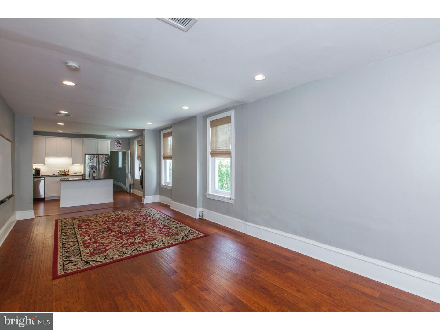 235 Roxborough Avenue Philadelphia, PA 19128 - Photo 4 of 22 a view of kitchen and hall with wooden floor