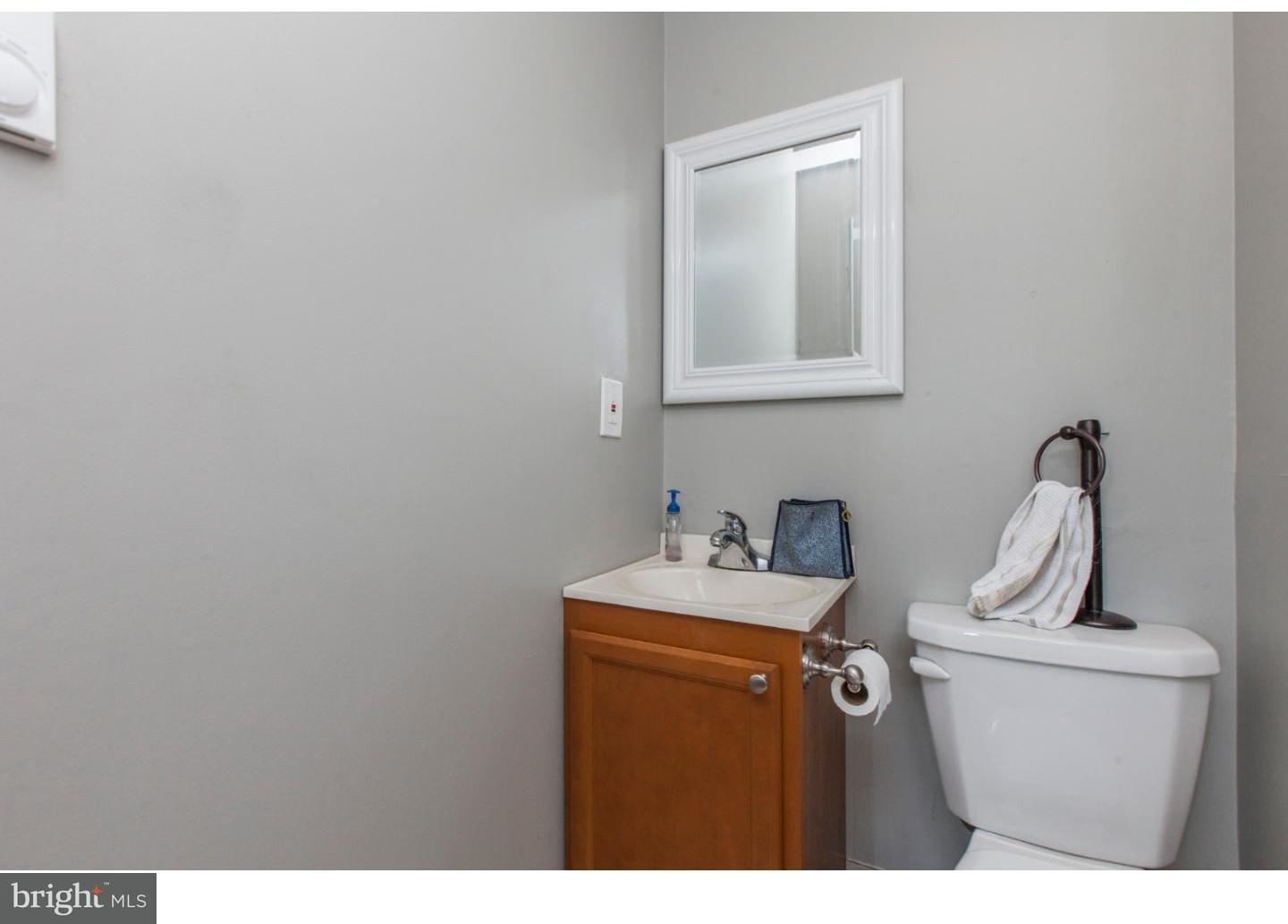 235 Roxborough Avenue Philadelphia, PA 19128 - Photo 10 of 22 a bathroom with a sink and a mirror
