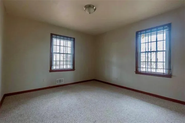 an empty room with windows